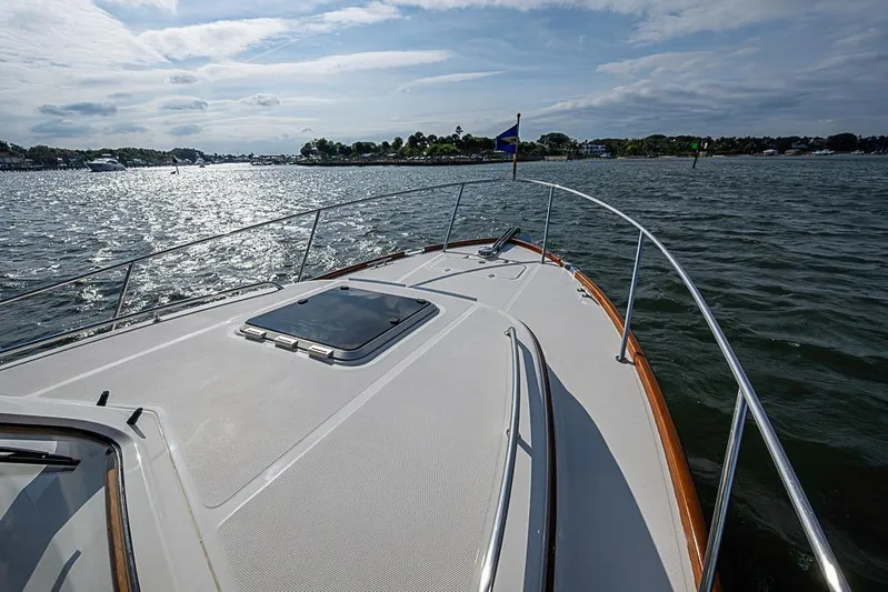Comin' In Hot Yacht Photos Pics 2016 Hinckley Talaria 34 yacht cruising on a sunny day, view from the deck.