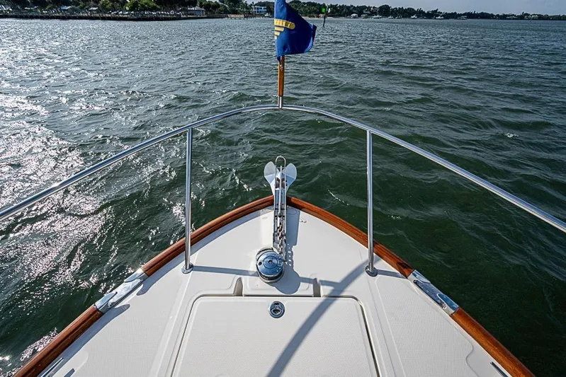 Comin' In Hot Yacht Photos Pics Bow view of 2016 Hinckley Talaria 34 yacht on open water.