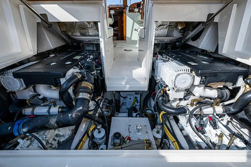 Comin' In Hot Yacht Photos Pics Engine room of a 2016 Hinckley Talaria 34 boat, showcasing dual engines.
