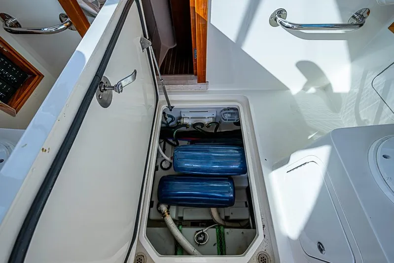 Comin' In Hot Yacht Photos Pics Open engine compartment of 2016 Hinckley Talaria 34 boat, showcasing internal components.