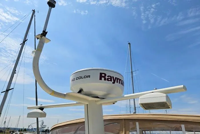  Yacht Photos Pics Radar equipment on 2007 Mainship 34 Trawler against a clear blue sky.