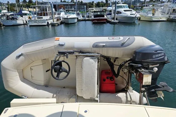  Yacht Photos Pics Inflatable boat with Yamaha motor docked near Mainship 34 Trawler, 2007 model.