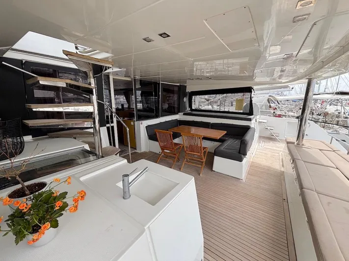 Avra Yacht Photos Pics Spacious deck of 2014 Lagoon 560 S2 yacht with seating and dining area.