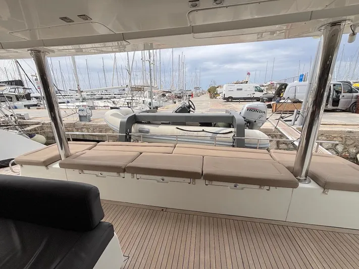 Avra Yacht Photos Pics Lagoon 560 S2 yacht deck with seating, docked at marina, 2014 model.