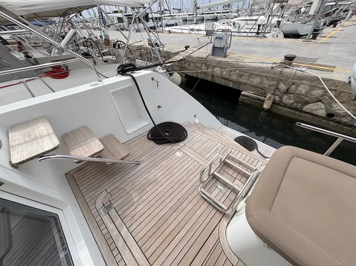 Avra Yacht Photos Pics Lagoon 560 S2 yacht deck, 2014 model, featuring teak flooring and comfortable seating.