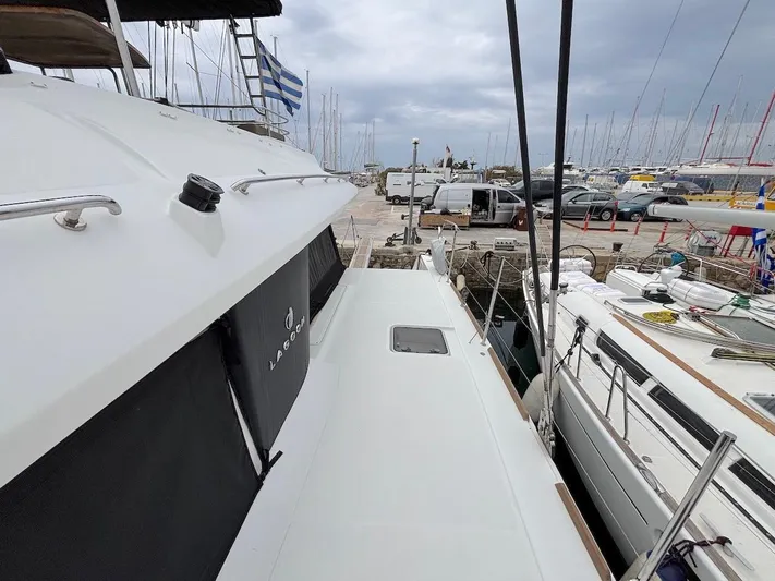 Avra Yacht Photos Pics Lagoon 560 S2 yacht docked at marina, overcast sky, 2014 model.