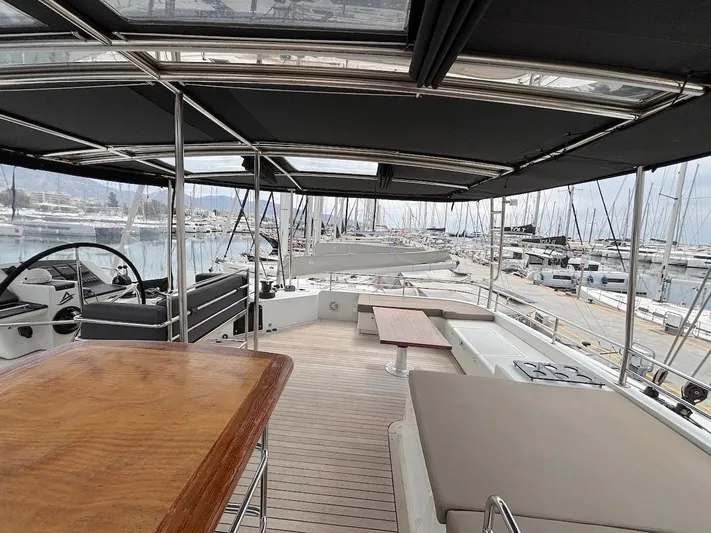 Avra Yacht Photos Pics Spacious deck of 2014 Lagoon 560 S2 yacht in marina setting.