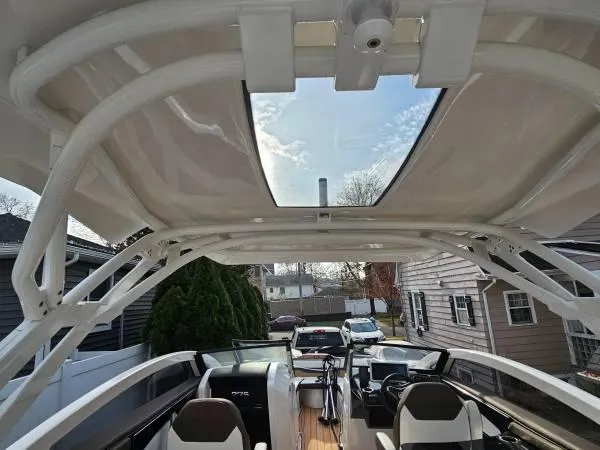  Yacht Photos Pics 2023 Yamaha Boats 275 SDX interior with open sunroof, showcasing modern design and seating.