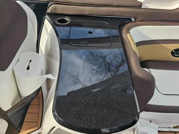  Yacht Photos Pics 2023 Yamaha Boats 275 SDX interior with sleek black table and seating.