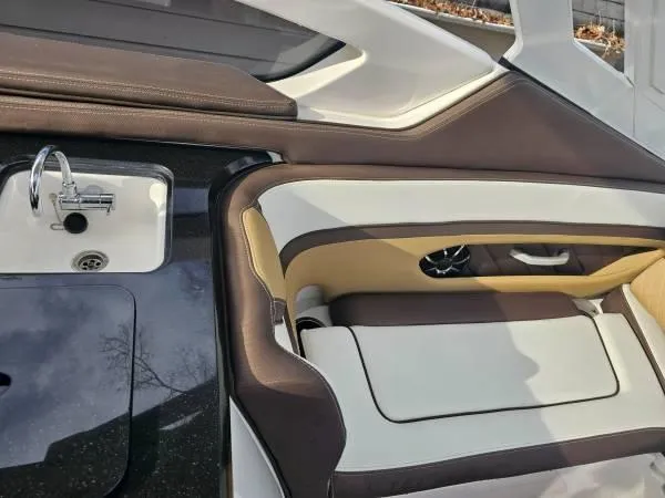  Yacht Photos Pics Interior of 2023 Yamaha Boats 275 SDX, featuring sleek seating and a compact sink.