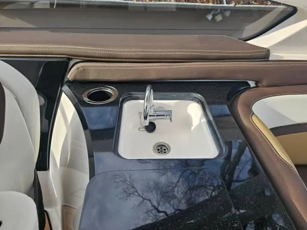  Yacht Photos Pics 2023 Yamaha Boats 275 SDX interior with sink and seating area.