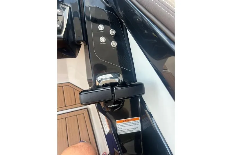  Yacht Photos Pics Control panel of 2023 Yamaha Boats 275SDX with buttons and throttle lever.