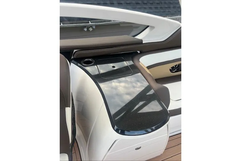  Yacht Photos Pics 2023 Yamaha Boats 275SDX interior with sleek black countertop and cup holder.
