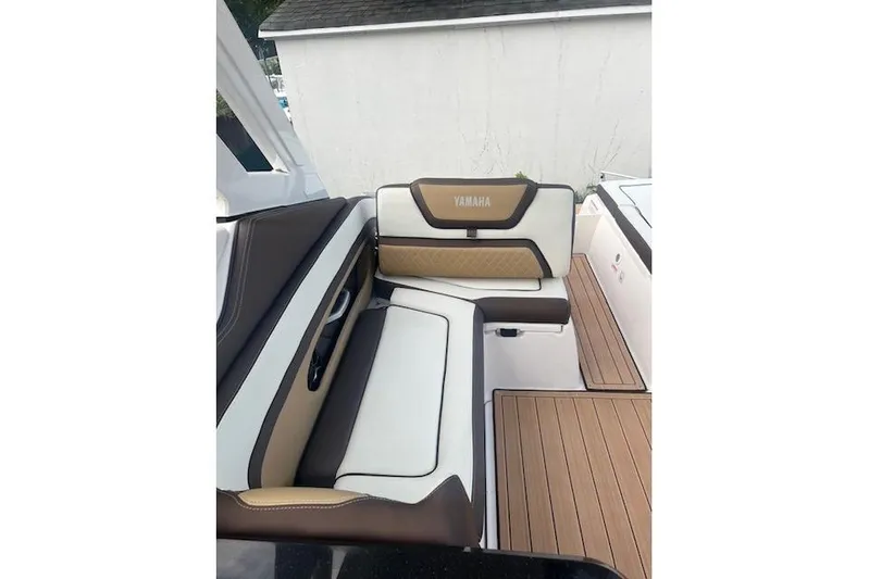  Yacht Photos Pics 2023 Yamaha Boats 275SDX interior seating with brown and white upholstery.