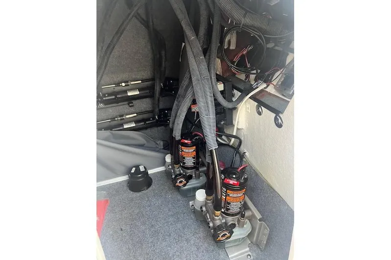  Yacht Photos Pics 2023 Yamaha Boats 275SDX engine compartment with hydraulic components and wiring.