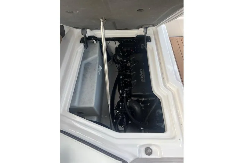  Yacht Photos Pics 2023 Yamaha Boats 275SDX engine compartment with open hatch, showcasing internal components.