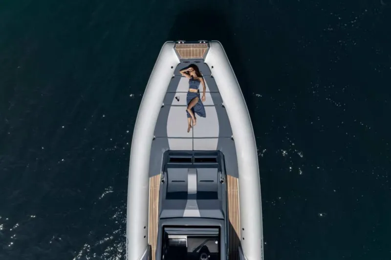  Yacht Photos Pics 2026 Ranieri CAYMAN 50 HARDTOP yacht with person sunbathing on deck, aerial view.