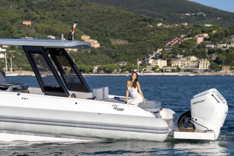  Yacht Photos Pics 2026 Ranieri CAYMAN 50 HARDTOP yacht cruising with scenic coastal backdrop.