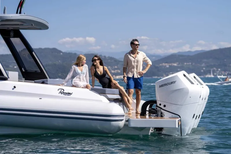  Yacht Photos Pics 2026 Ranieri CAYMAN 50 HARDTOP yacht with people enjoying a sunny day on the water.