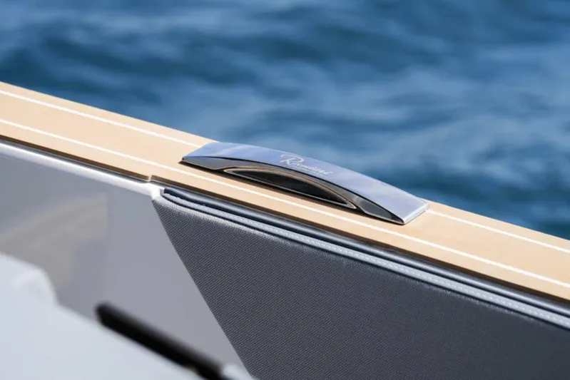  Yacht Photos Pics 2026 Ranieri CAYMAN 50 HARDTOP detail with sleek handle against ocean backdrop.