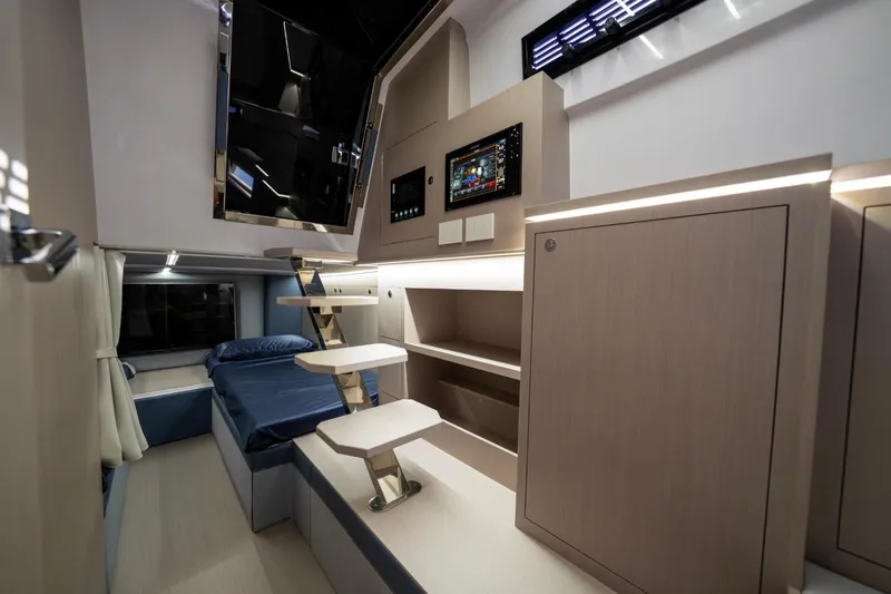  Yacht Photos Pics Luxurious interior of 2026 Ranieri CAYMAN 50 HARDTOP yacht with modern design and cozy sleeping area.