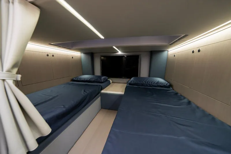  Yacht Photos Pics Interior cabin of 2026 Ranieri CAYMAN 50 HARDTOP with twin beds and modern lighting.