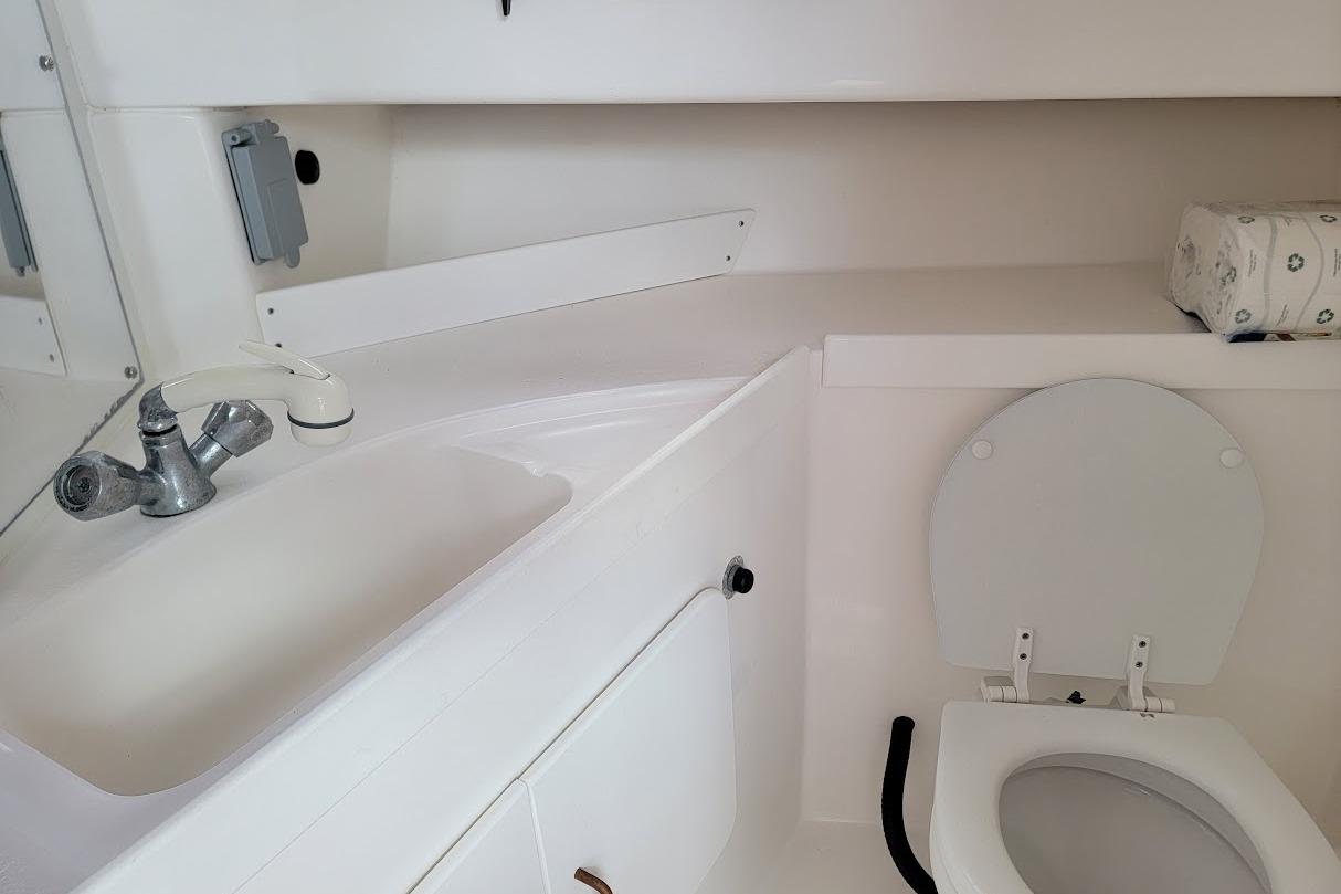 2000 Stamas 310 Express boat bathroom with sink and toilet.