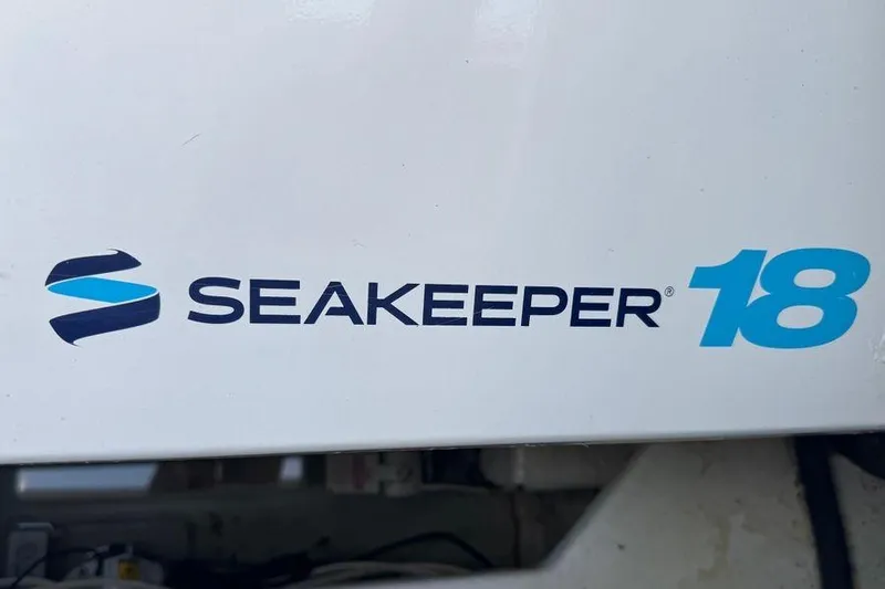 Miss Maggie Yacht Photos Pics Seakeeper 18 logo on 2002 Viking 61 Enclosed Bridge yacht.