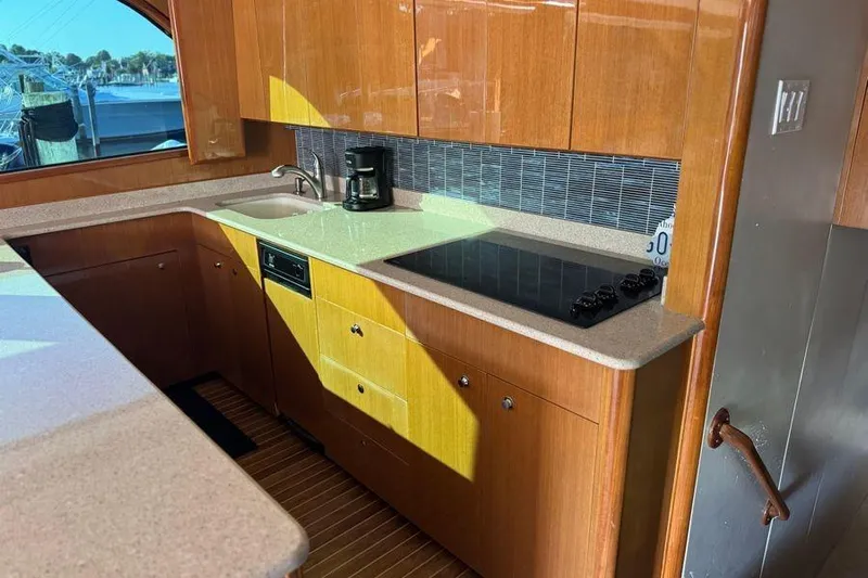 Miss Maggie Yacht Photos Pics Luxurious kitchen in 2002 Viking 61 Enclosed Bridge yacht with modern appliances.