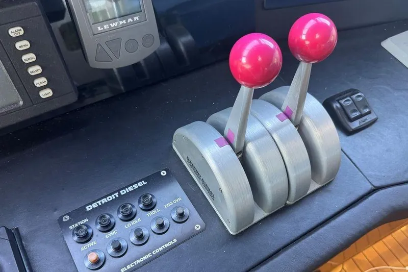 Miss Maggie Yacht Photos Pics Control panel of a 2002 Viking 61 Enclosed Bridge yacht with throttle levers.