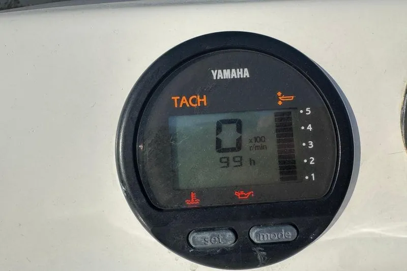 Miss Maggie Yacht Photos Pics Yamaha tachometer displaying 0 RPM and 99 hours on a Viking 61 Enclosed Bridge.