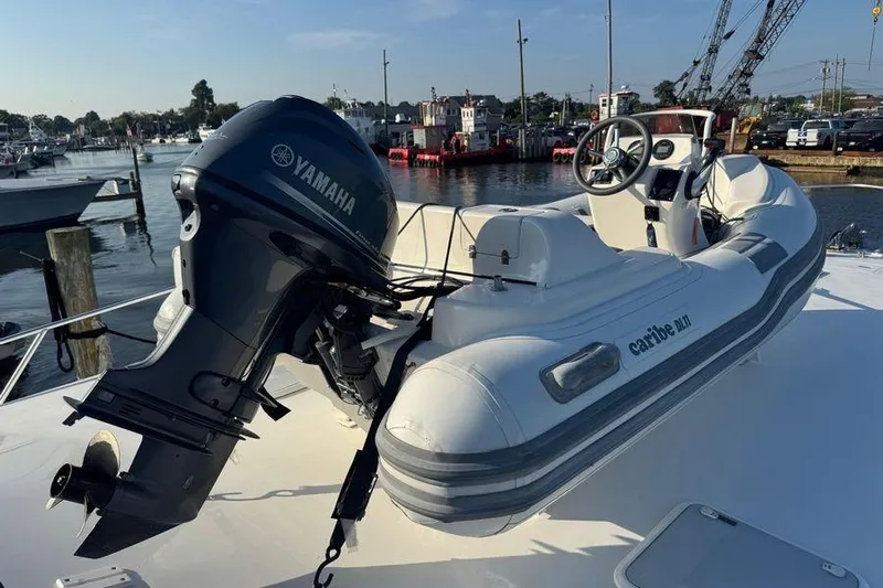 Miss Maggie Yacht Photos Pics Inflatable boat with Yamaha motor on 2002 Viking 61 Enclosed Bridge yacht.