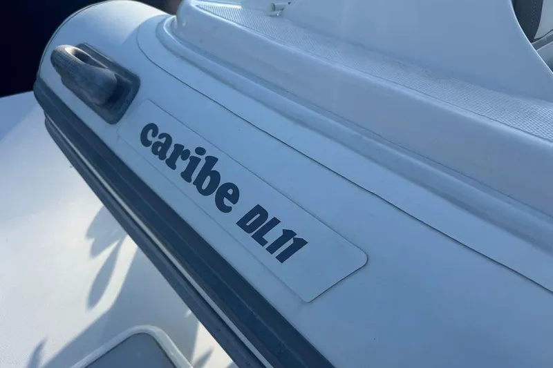 Miss Maggie Yacht Photos Pics Caribe DL11 inflatable boat on 2002 Viking 61 Enclosed Bridge yacht.