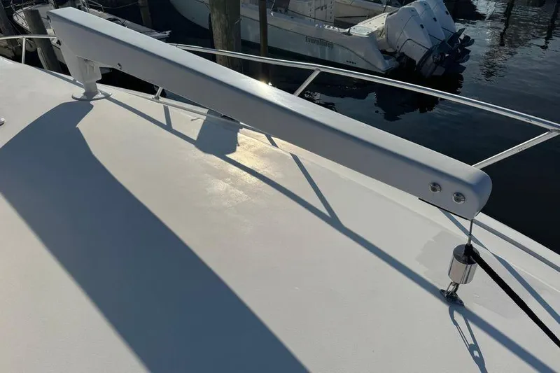 Miss Maggie Yacht Photos Pics 2002 Viking 61 Enclosed Bridge yacht deck with railing and davit system.