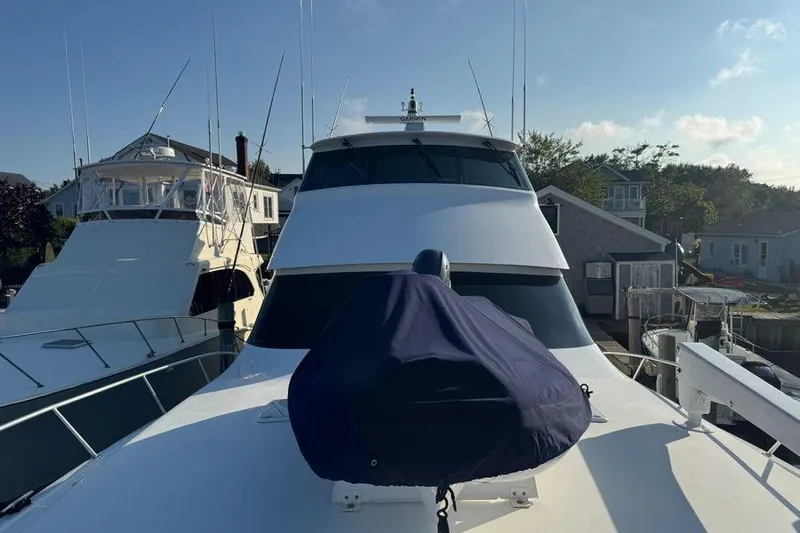 Miss Maggie Yacht Photos Pics 2002 Viking 61 Enclosed Bridge yacht docked at marina under clear sky.