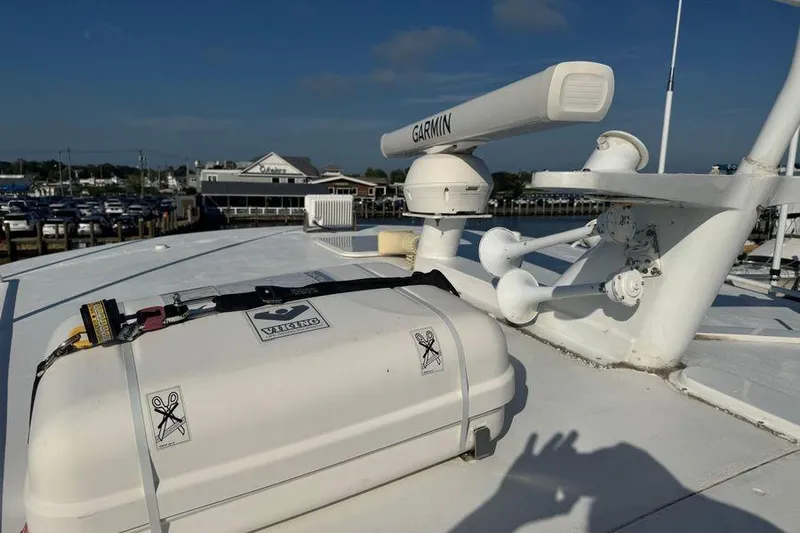 Miss Maggie Yacht Photos Pics Rooftop of 2002 Viking 61 Enclosed Bridge with Garmin radar and equipment.