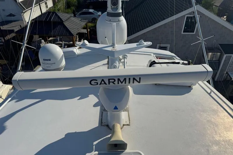 Miss Maggie Yacht Photos Pics Radar equipment on 2002 Viking 61 Enclosed Bridge yacht with Garmin and TracPhone systems.