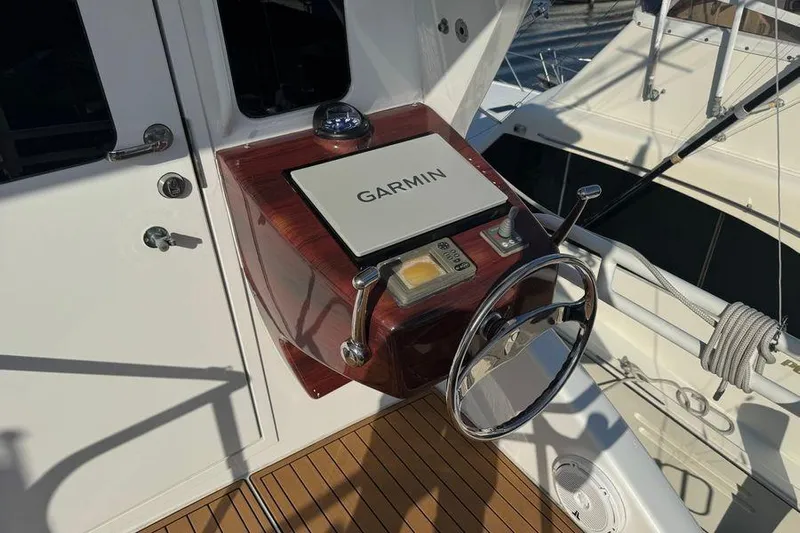 Miss Maggie Yacht Photos Pics Steering console of 2002 Viking 61 Enclosed Bridge with Garmin navigation system.