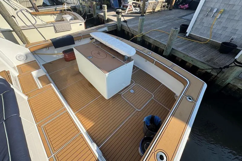 Miss Maggie Yacht Photos Pics 2002 Viking 61 Enclosed Bridge yacht with teak deck at dock.