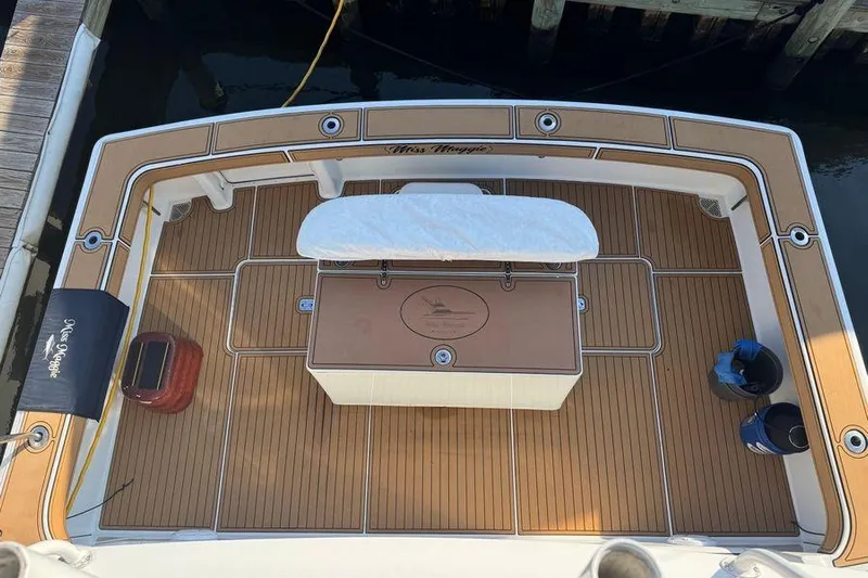 Miss Maggie Yacht Photos Pics 2002 Viking 61 Enclosed Bridge yacht deck with teak flooring and fishing station.