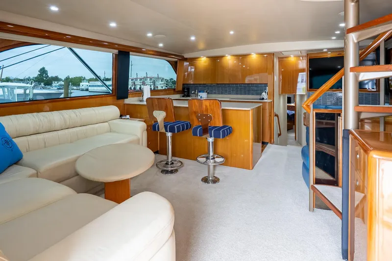 Miss Maggie Yacht Photos Pics Luxurious interior of 2002 Viking 61 Enclosed Bridge yacht with modern furnishings.