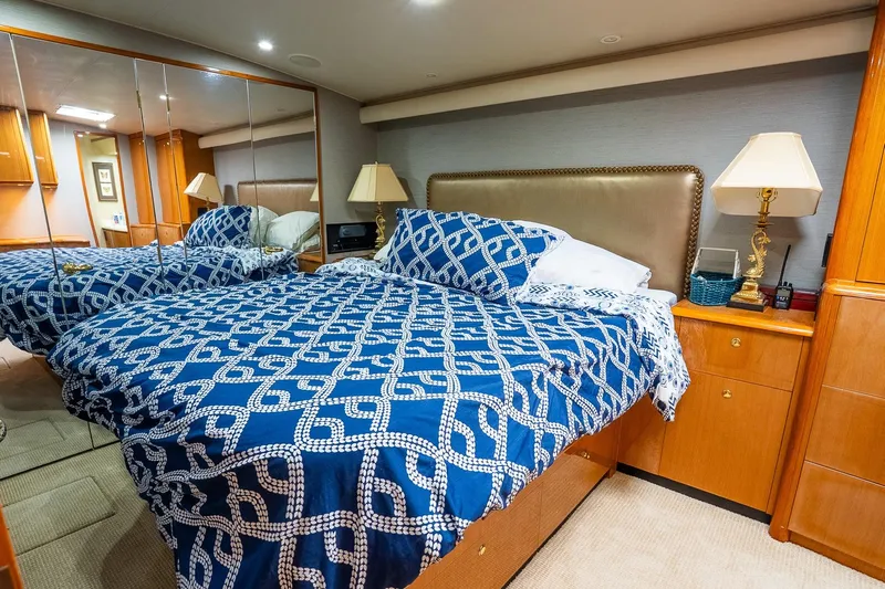 Miss Maggie Yacht Photos Pics Luxurious bedroom interior on 2002 Viking 61 Enclosed Bridge yacht with elegant decor.