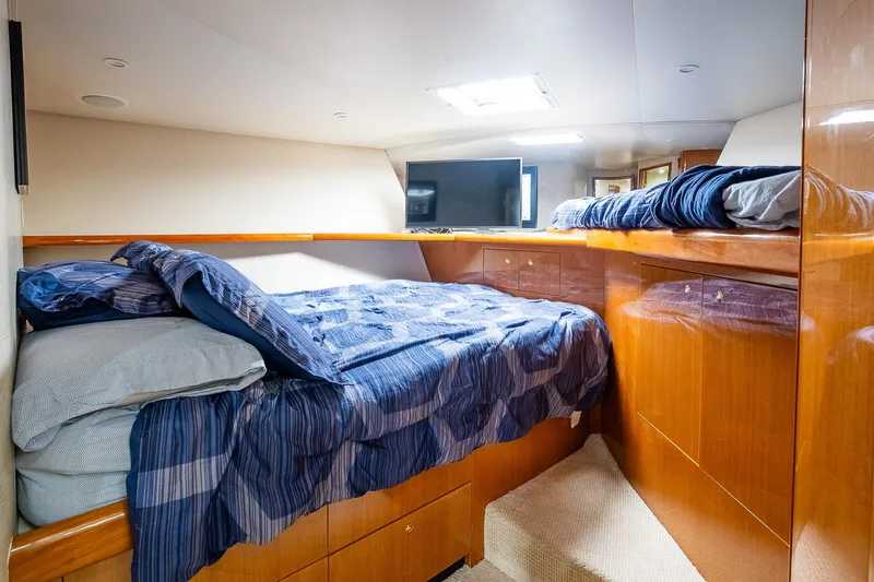 Miss Maggie Yacht Photos Pics Luxurious cabin interior of 2002 Viking 61 Enclosed Bridge yacht with cozy bedding.