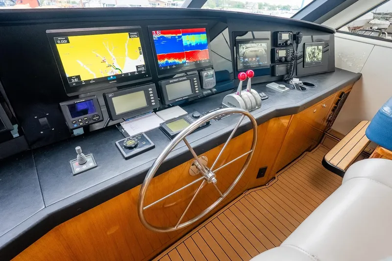 Miss Maggie Yacht Photos Pics Control panel of 2002 Viking 61 Enclosed Bridge yacht with navigation equipment.