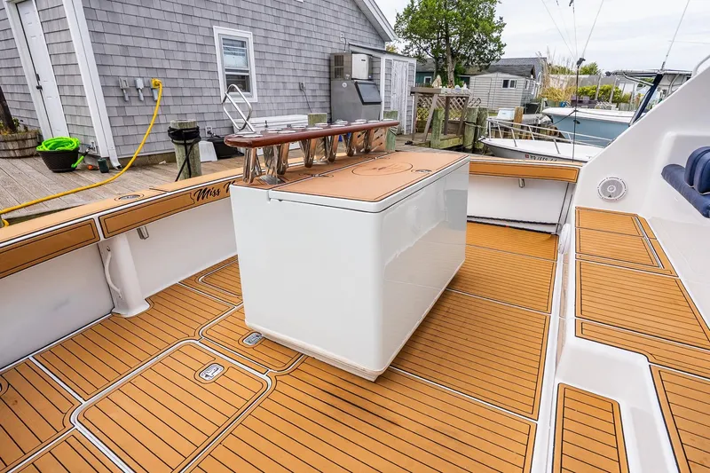 Miss Maggie Yacht Photos Pics 2002 Viking 61 Enclosed Bridge yacht deck with teak flooring and fishing station.