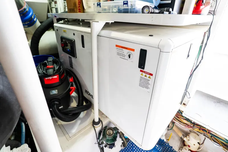 Miss Maggie Yacht Photos Pics Engine room of 2002 Viking 61 Enclosed Bridge with equipment and wiring.