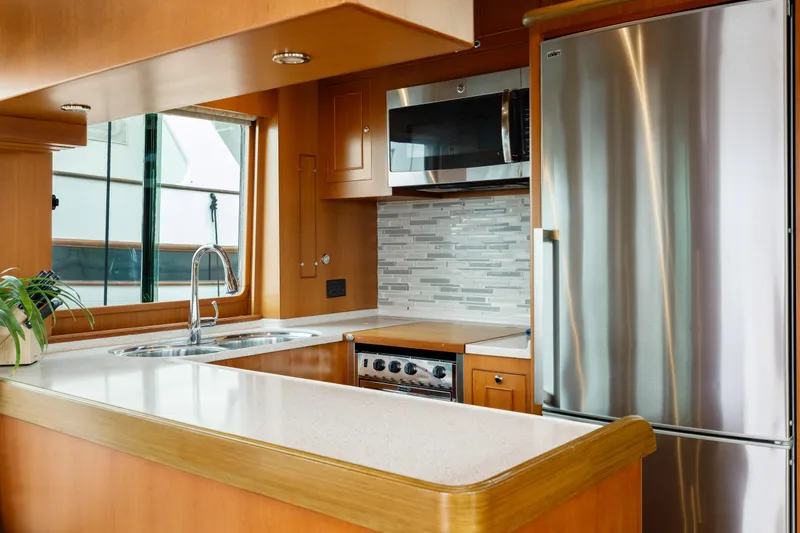 Tumbleweed Yacht Photos Pics Modern kitchen in 2016 North Pacific 49 Pilothouse yacht with stainless steel appliances.