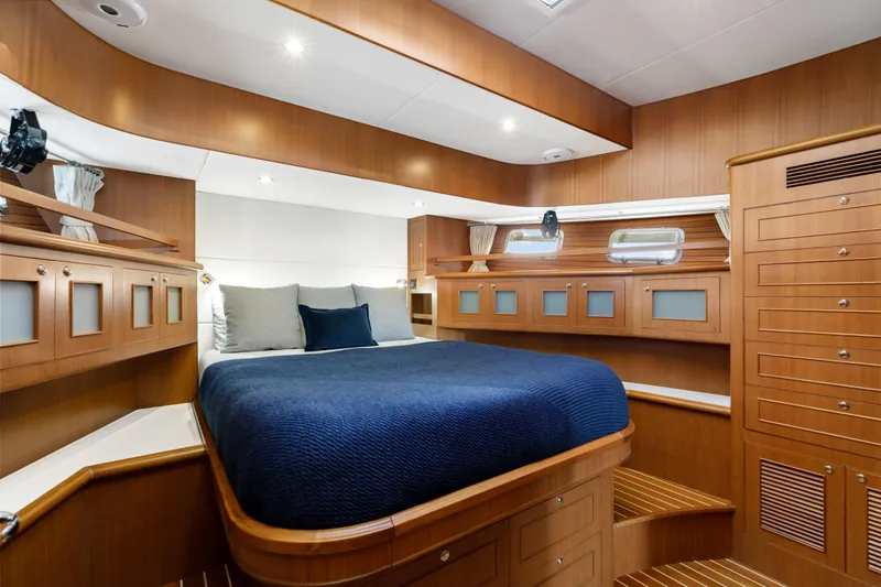 Tumbleweed Yacht Photos Pics Luxurious cabin interior of 2016 North Pacific 49 Pilothouse yacht with wood finish.