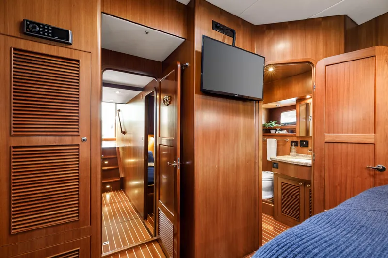 Tumbleweed Yacht Photos Pics Interior of 2016 North Pacific 49 Pilothouse yacht with wood paneling and modern amenities.