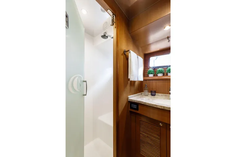Tumbleweed Yacht Photos Pics Luxurious bathroom in 2016 North Pacific 49 Pilothouse yacht with shower and vanity.